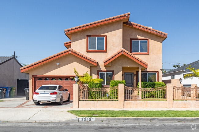 Larger two story homes with red brick roofs add color and energy to the vibrant West Adams.