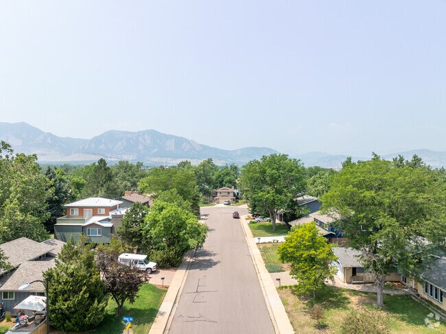 Overlooking mountains create a beautiful vista on Southeast Boulder's tree lined streets.