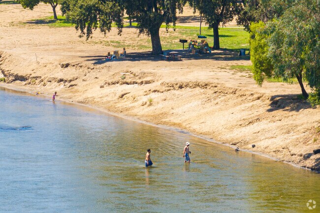 Laton residents cool off in the river at Laton Kingston Regional Park.