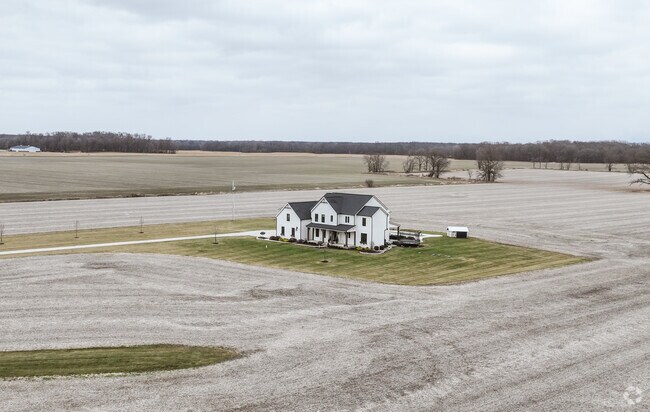 A large farm home sits alone on a large piece of land in Marlboro.