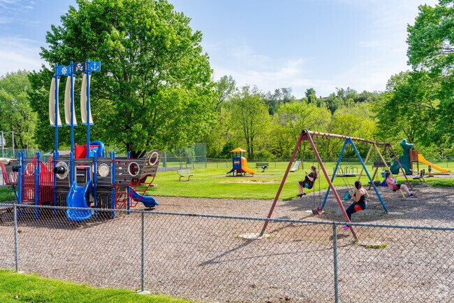 Children can play on the pirate ship playground or enjoy the swings at Canal Street Park.