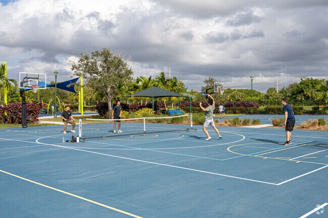 Friends play a priceless pickleball game at the Indian Trace Park in The Springs.