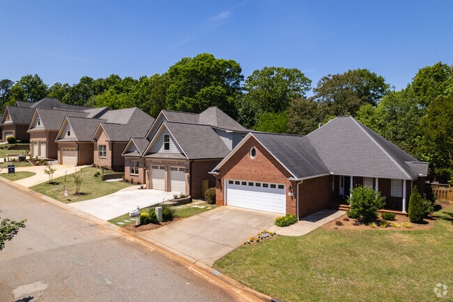Some homes in Hillbrook have small front yards and driveways.