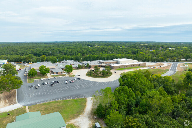 Warsaw High School campus includes sports fields and parking.