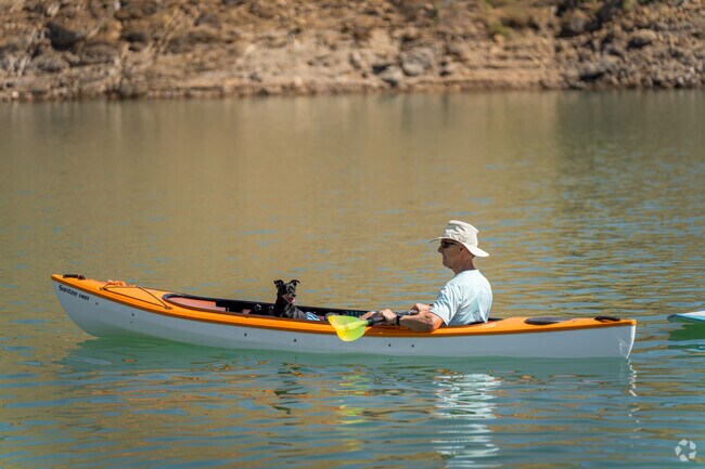 A gentleman brings best friend along for a kayak ride on Shasta Lake.