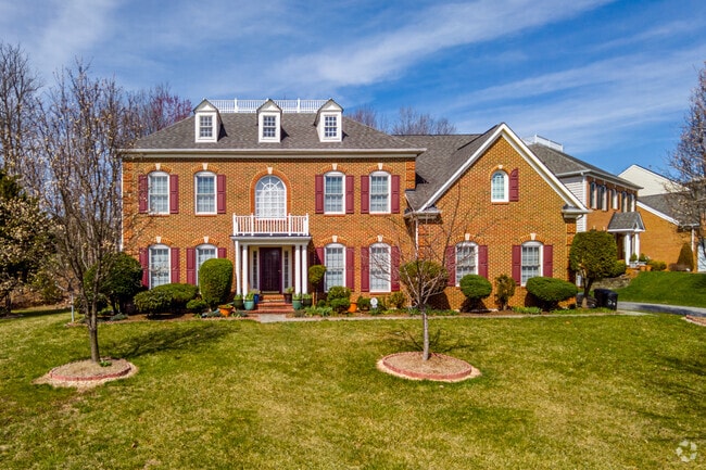 Colonial Revivals have large front lawns to match in the town of Calverton, Maryland.