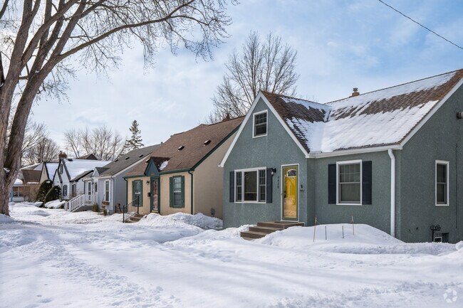 Residents of this neighborhood enjoy lush lawns and large sidewalks.
