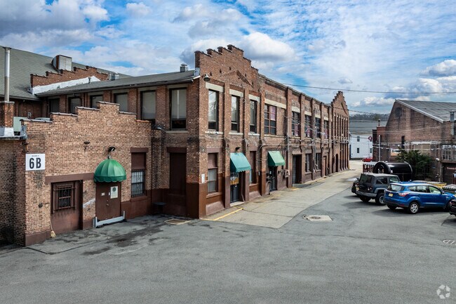 A brick warehouse from the former American Hard Rubber Co. plant in downtown Butler is now filled with a mix of businesses, including a gym, brewery and various manufacturing operations.