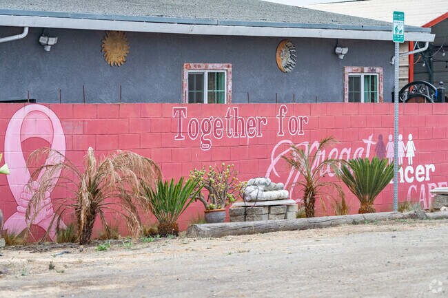 Bolsa Knolls murals celebrate breast cancer awareness through vibrant art.