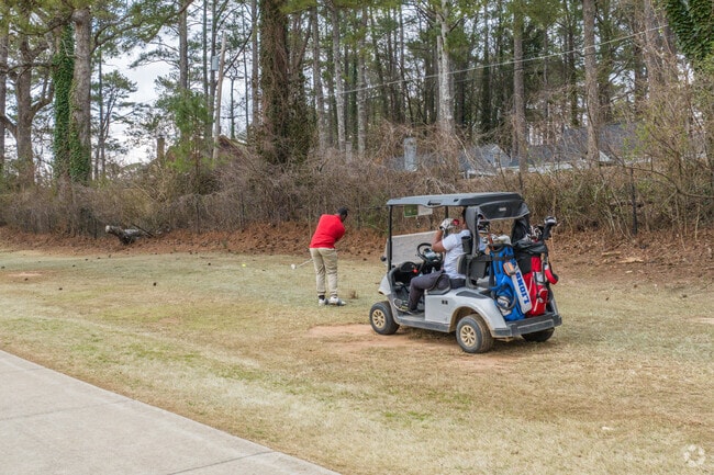 Residents in Audubon Forest spend their afternoons on the course at John A. White Golf Course.