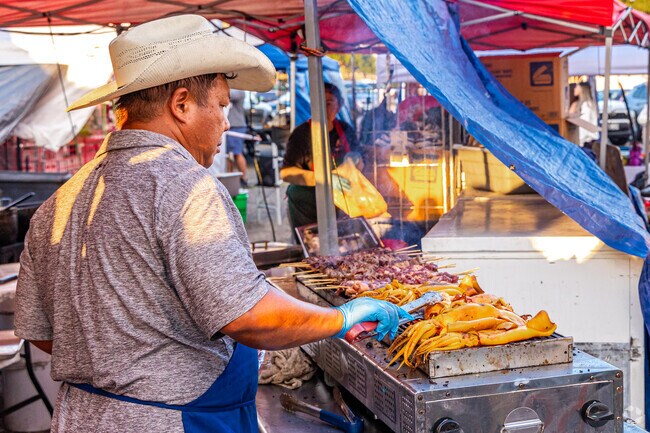 The chef from Wan's Thai Kitchen grilled calamari on the open grill at the St. Paul Asian Street Food Night Market.