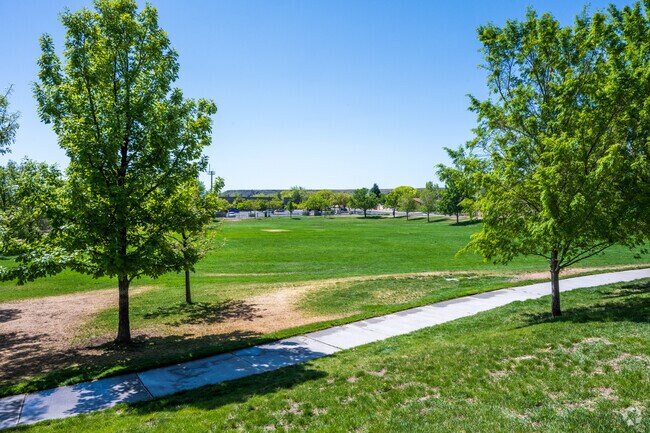 Santa Fe Village Park features a large grass area.