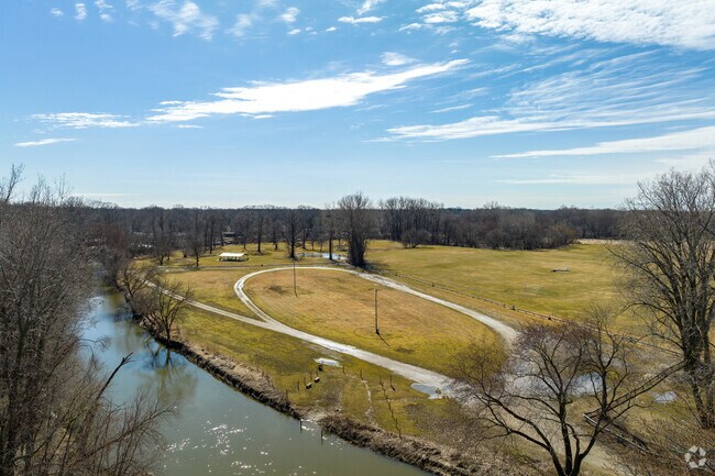An aerial view of a river that runs through Frank H. Budd Park