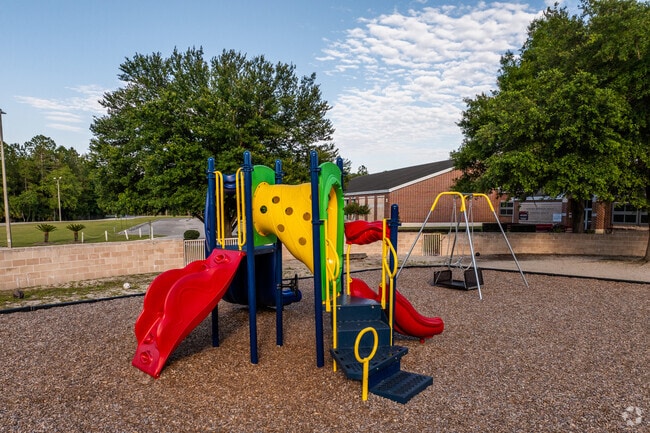 Kids play on the playground at MacClenny Elementary School.