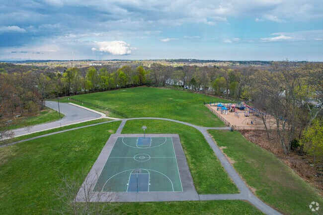 Northeast Elementary School has a playground and a basketball court for students.