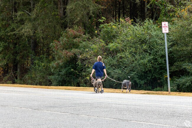 Residents can walk the long path with their pets at Leroy H. Johnson Park.