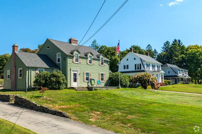 Overlooking Laurel Hill, these Colonial homes showcase classic New England style.