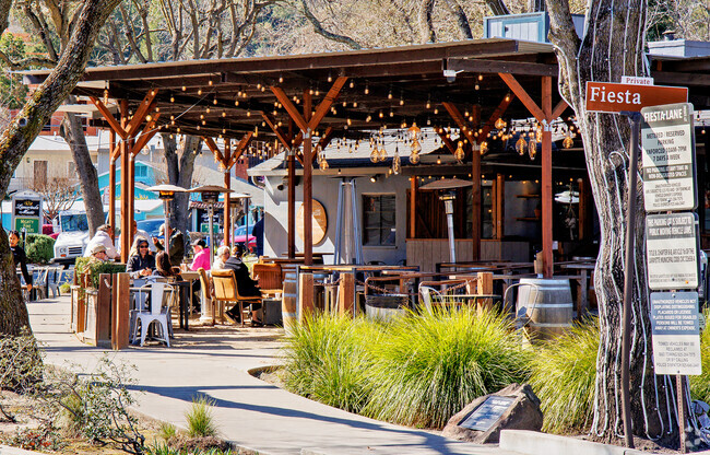 Residents enjoy dining on covered patios in downtown Lafayette near Tanglewood, Lafayette.