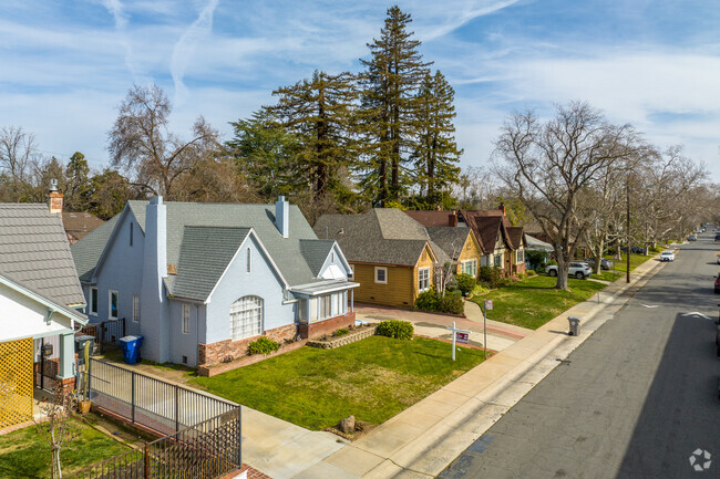 Charming single-family homes with ornate front lawns are typical in Elmhurst.