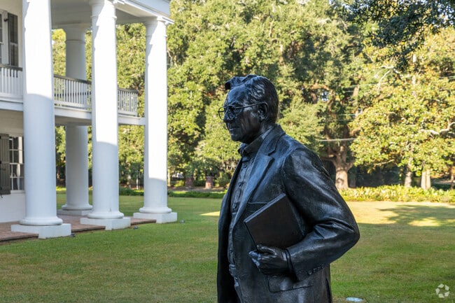 A historic statue stands tall outside the Hilliard Art Museum, one of many in Freetown-Port Rico.