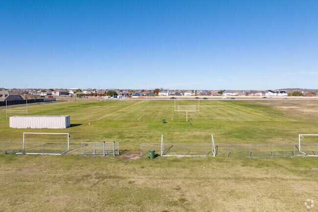 Vast playing fields at Heritage Elementary School in Ft. Worth echo with the sounds of teamwork.