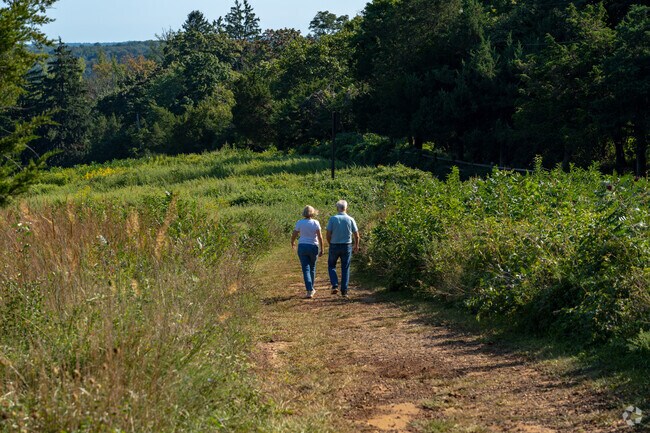 Residents love to walk through the many grassy paths of Huber Woods.
