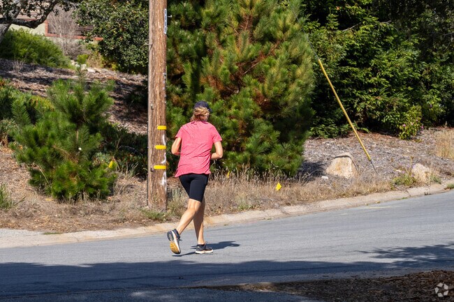 Empowering strides through the neighborhood, she conquers each step with determination.