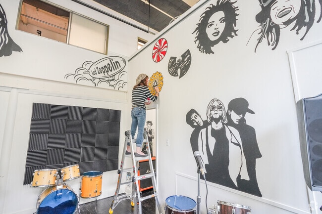 racks Music Shop showcases vibrant artwork celebrating iconic music legends.