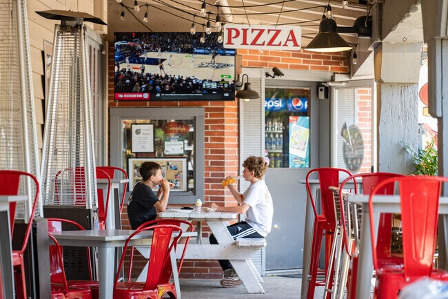 Proctor Terrace youth enjoy a basketball game and a slice at Sandy's Pizza.