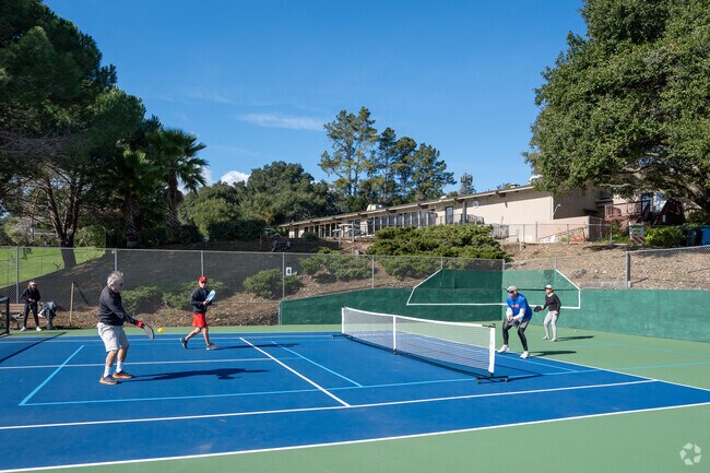 Smashing it out on the pickleball court of Emerald Hills neighborhood.