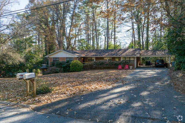 Ranch style homes in Biltmore Acres sit back on wooded lots with surrounded by shade trees.
