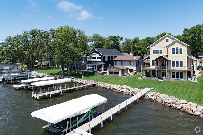 Lake houses in every shape and size line the shores of Arnolds Park, most with private docks.