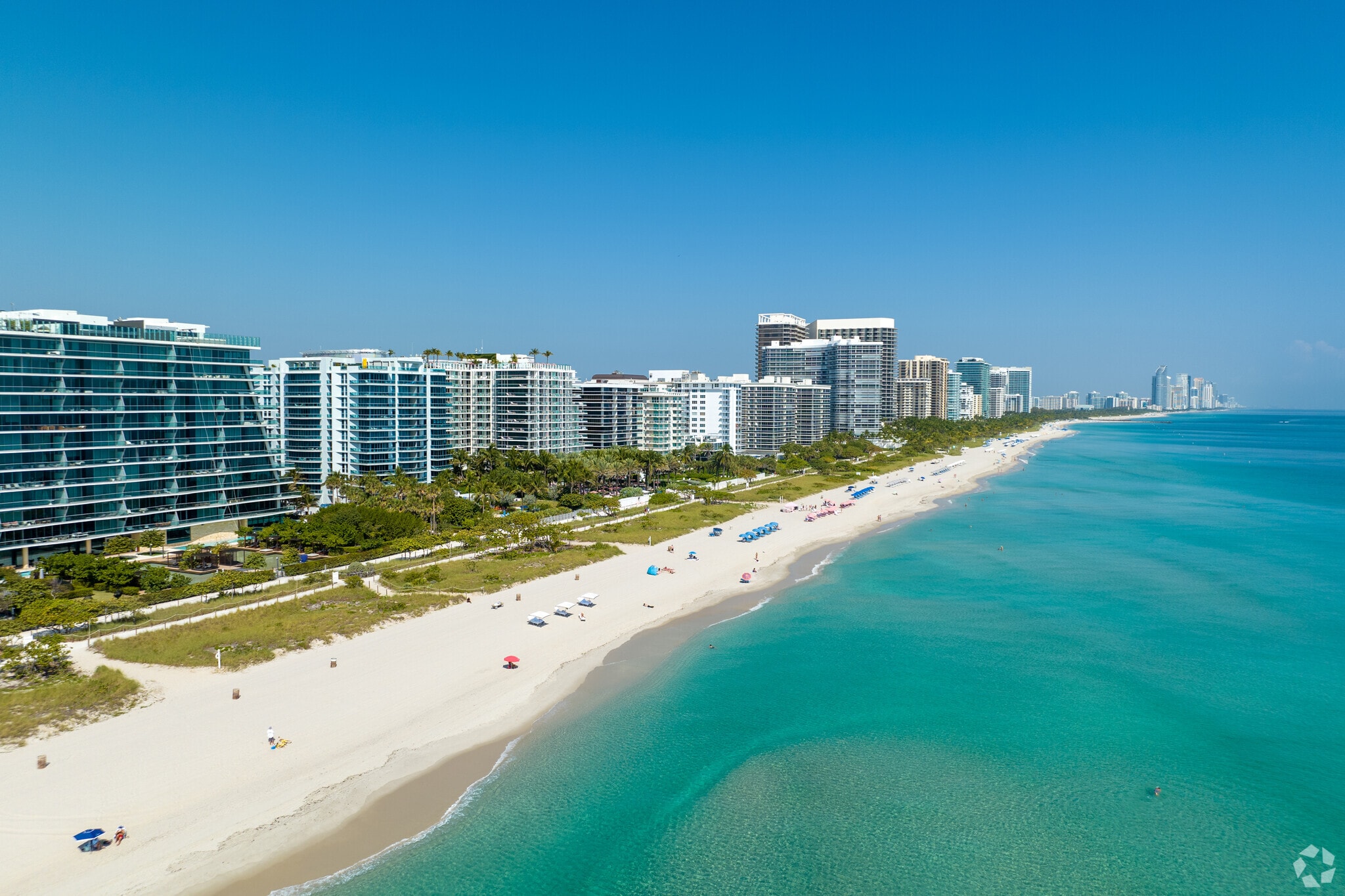 The beautiful and clear blue ocean washes over Surfside's clear beaches.
