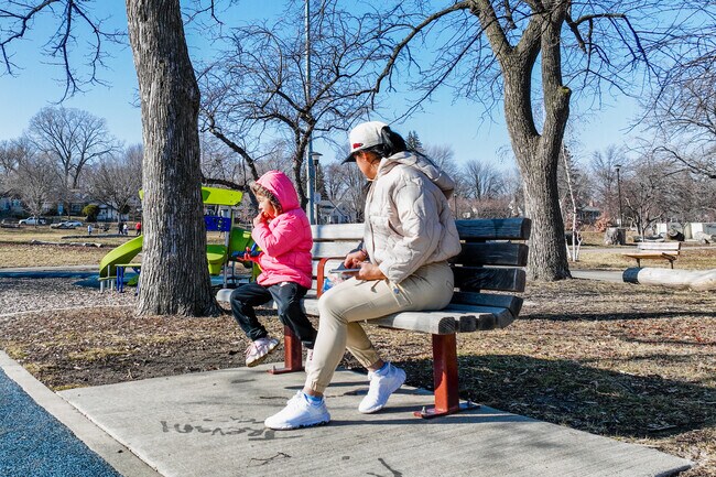 A mother and daughter enjoying a beautiful day at Folwell Park.
