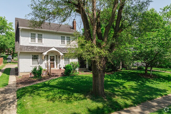 This modest Cape Cod inspired home blends traditional charm with mid-century practicality.