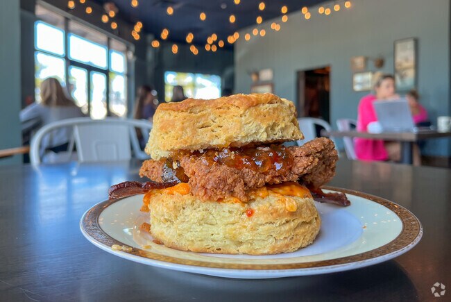 Copperline Coffee and Cafe's famous fried chicken biscuit brings out Tomoka Farm residents.