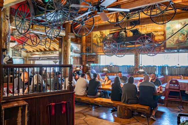 At Red's Old 395 Grill, just minutes from Capitol Village, American cuisine and hearty gatherings are served under a ceiling of wagons and Western nostalgia.