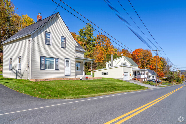 A row of homes along Graniteville road are elevated above the main road.