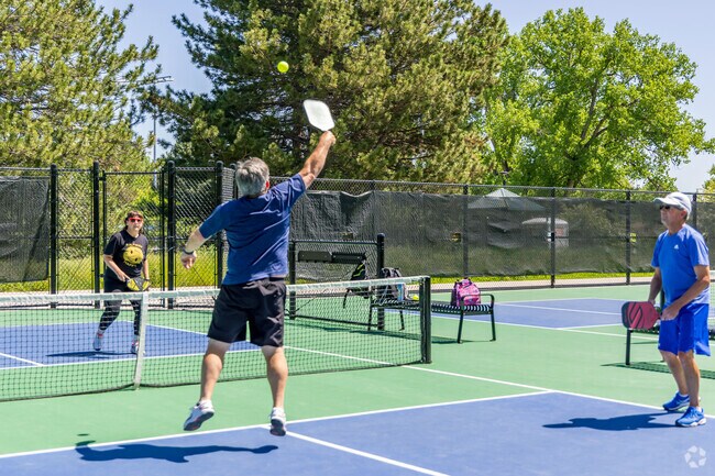 Pickleball players battle in the park’s four courts, at Bear Valley Park.
