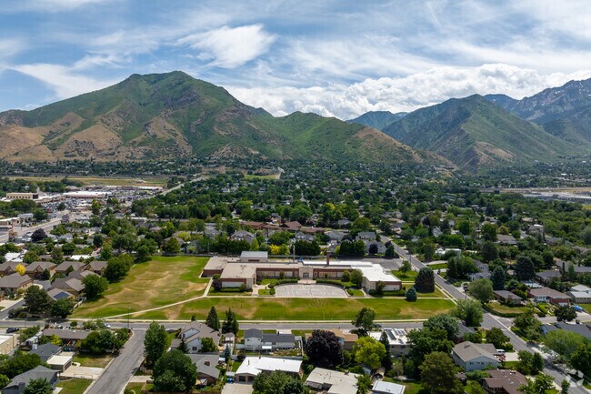 An overview of the Reid School campus surrounded by lush greenery in East Millcreek.