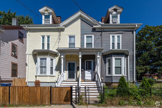 Two neighbors under one roof share a different favorite color in Washington Park.