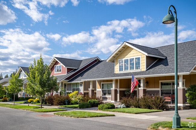 Rows of colorful Craftsman homes are nestled into the community of Mill River.