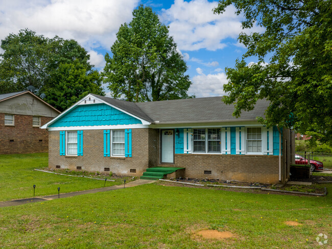 Some Camelot homes like this bungalow stand out with a pop of color.