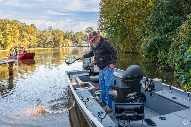 River Pointe Plantation fisherman release their catch back into Lake Chehaw.