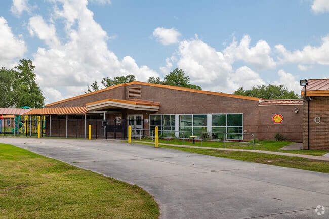 Norco Elementary is made of brick and has a playground for kids to have fun during recess.