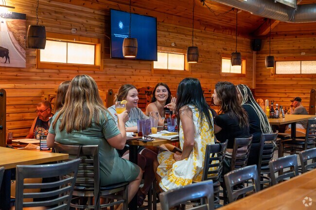 Friends enjoy dinner at the Bison Street Pub in West Brookfield.