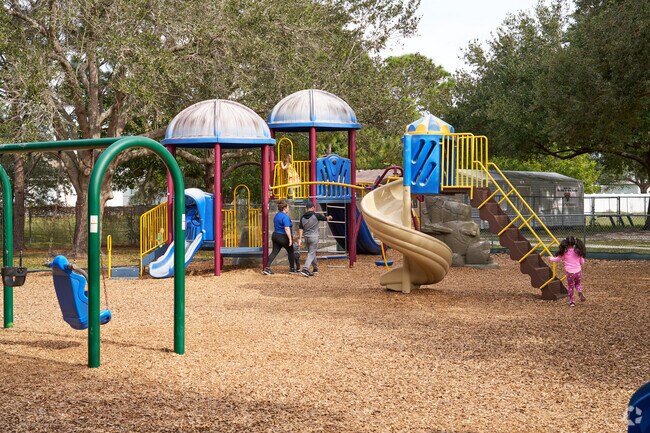 Kids enjoy slides and swings at Turtle Run Park’s playground in Cashmere Cove.