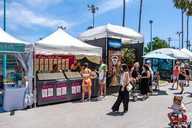 Visitors browse through diverse vendor booths at the Delray Beach Memorial Day Craft Festival.