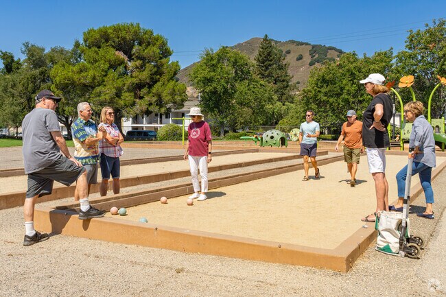A group of Downtown San Luis Obispo friends play a rousing game of bocce ball.
