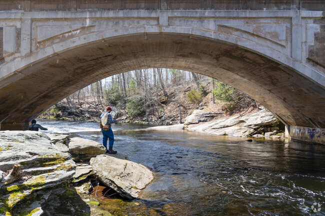 A fisherman casts his line into the Nachaug River in Chaplin in hopes of catching trout.
